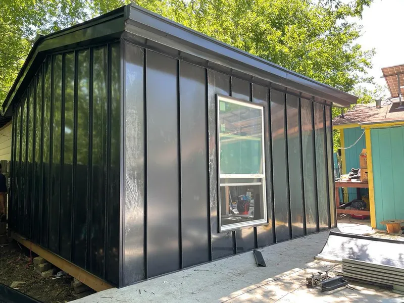 Black standing seam metal wall panels for Roof Inspection in Lenox