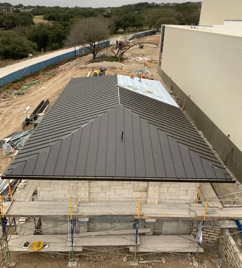 Metal roof new construction with scaffolding in Lenox